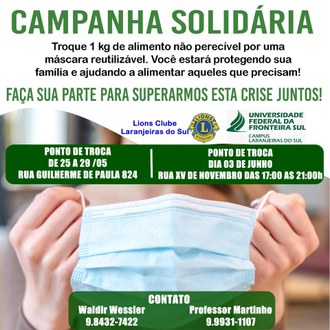 Uma imagem de mãos segurando uma máscara, com os dizeres "Campanha solidária - Troque 1 kg de alimento não perecível por uma máscara reutilizável. Você estará protegendo sua família e ajudando a alimentas aqueles que precisam!"